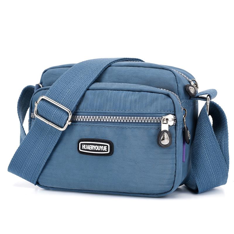 NK39UR Vrouwen waterdichte nylon schoudertas messenger bag lichtgewicht pakket grote capaciteit casual effen kleur reizen crossbody tas portemonnee 20x9x16cm paars