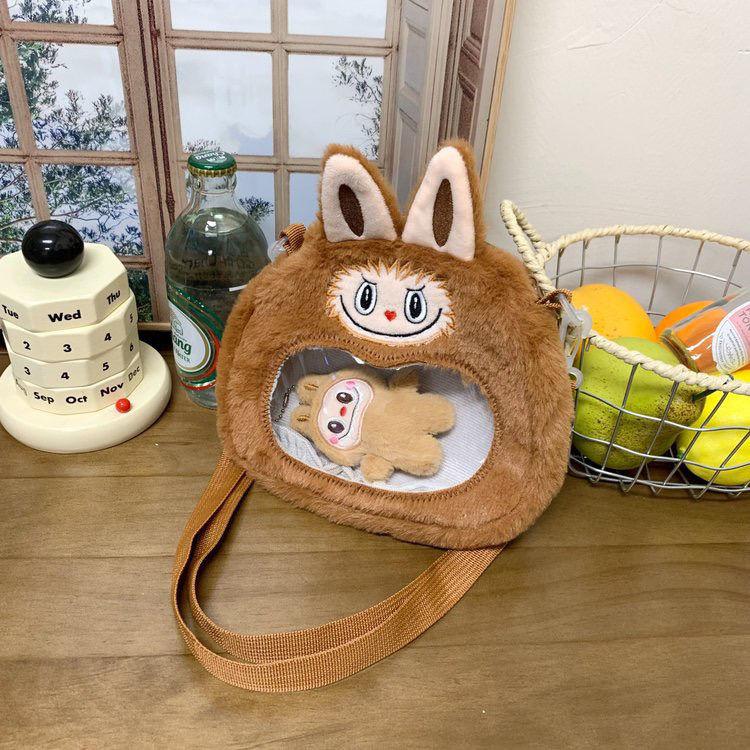 The warm winter labubu's new cartoon plush crossbody bag is a cute and plush birthday gift bruin