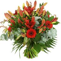Boeketcadeau Kerstboeket van rode lelies en bloemen