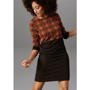 Aniston SELECTED Jerseyjurk met modern motief- en stippendesign