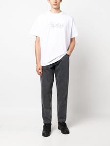 Jeans met toelopende pijpen - Zwart