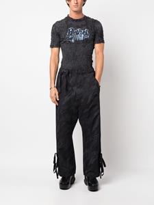 Maharishi Trainingsbroek met camouflageprint - Zwart