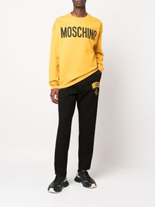 Moschino Broek met logoprint - Zwart