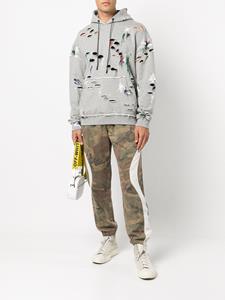mostlyheardrarelyseen Mostly Heard Rarely Seen Joggingbroek met camouflageprint - Bruin