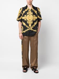 Versace Broek met barokprint - Bruin