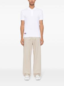commedesgarçonsplay Comme Des Garçons Play x The Artist Invader poloshirt met applicatie - Wit