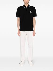 Musium Div. logo-embroidered cotton polo shirt - Zwart