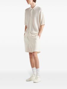 Prada Poloshirt met geborduurd logo - Beige