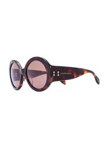 Alexander McQueen Eyewear zonnebril met ministuds rond montuur - Bruin