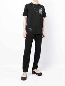 White Mountaineering Joggingbroek met logoprint - Zwart