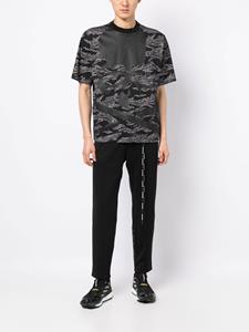 Mastermind World Trainingsbroek met camouflageprint - Zwart