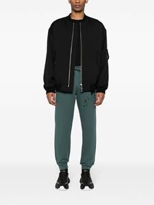 Moschino logo-print track pants - Groen