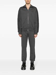 Versace Trainingsbroek met toelopende pijpen en barokpatroon - Grijs