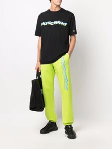 Moschino Joggingbroek met logoprint - Groen