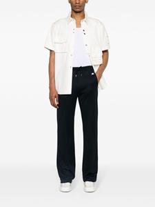Courrèges logo-patch interlock track pants - Blauw