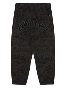 AAPE BY *A BATHING APE graffiti-print track pants - Bruin