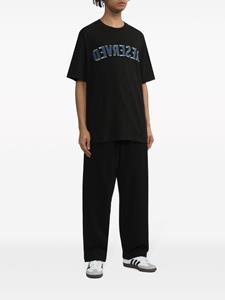 Izzue logo-embroidery cotton track pants - Zwart