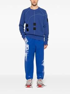 A-COLD-WALL* Katoenen trainingsbroek met print - Blauw