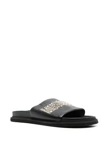 Moschino Slippers verfraaid met studs - Zwart