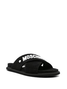 Moschino logo-embossed crossover-strap sandals - Zwart