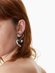 Nina Ricci Oorbellen met hart-amulet - Zilver