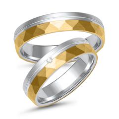 Unique Trouwringen in wit- en geelgoud met diamant