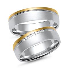 Unique Trouwringen in wit- en geelgoud met 7 diamanten