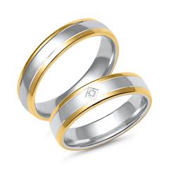 Unique Trouwringen in wit- en geelgoud met diamant