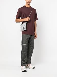 And Wander Dyneema schoudertas met logoprint - Beige
