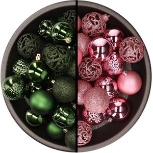 Kunststof kerstballen 74x stuks donkergroen en roze 6 cm -