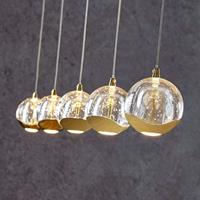 Lucande LED-Pendellampe Hayley, 5-fl., länglich, gold